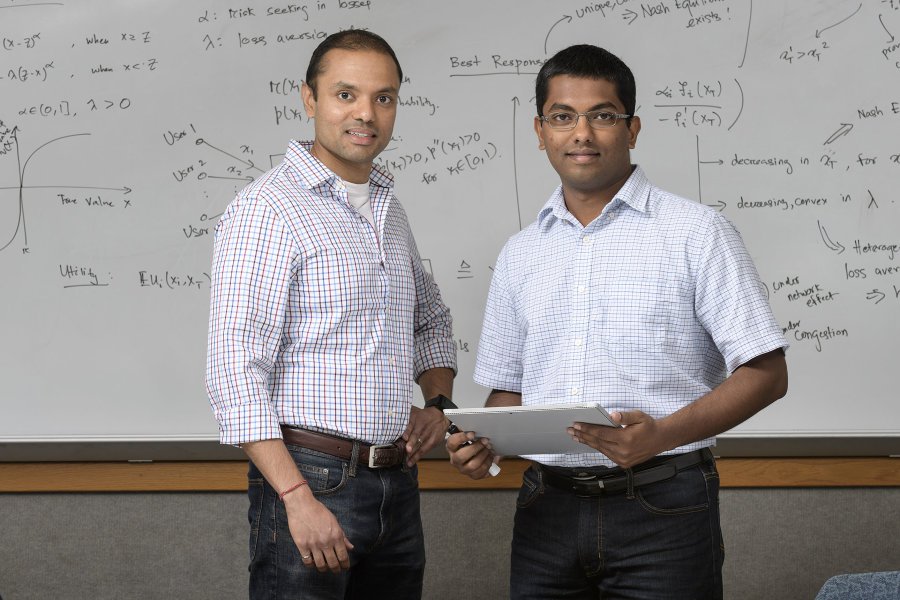 Shreyas Sundaram, at left, an assistant professor in Purdue University's School of Electrical and Computer Engineering, and doctoral student Ashish Hota are performing research in game theory that harnesses the Nash equilibrium, developed by Nobel laureate John Nash, whose life was chronicled in the film "A Beautiful Mind." Credit: Purdue University photo/John Underwood