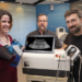 GE Researches Pose With Prototype Ultrasound Modulation Device