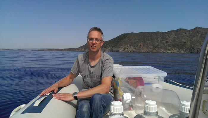 Researcher taking samples off the French coast.