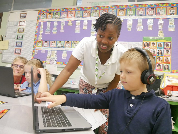 Teacher and student in one of Springfield's public elementary schools learning CSforALL