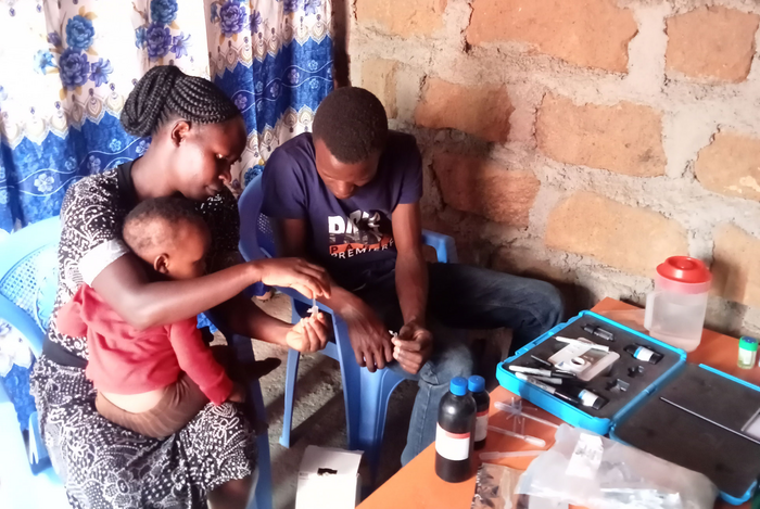 A family in rural Kenya tests water quality