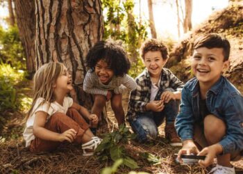 Children playing in forest