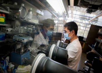 A researcher working in a lab at NSF's Materials Research Science and Engineering Center at UC San Diego