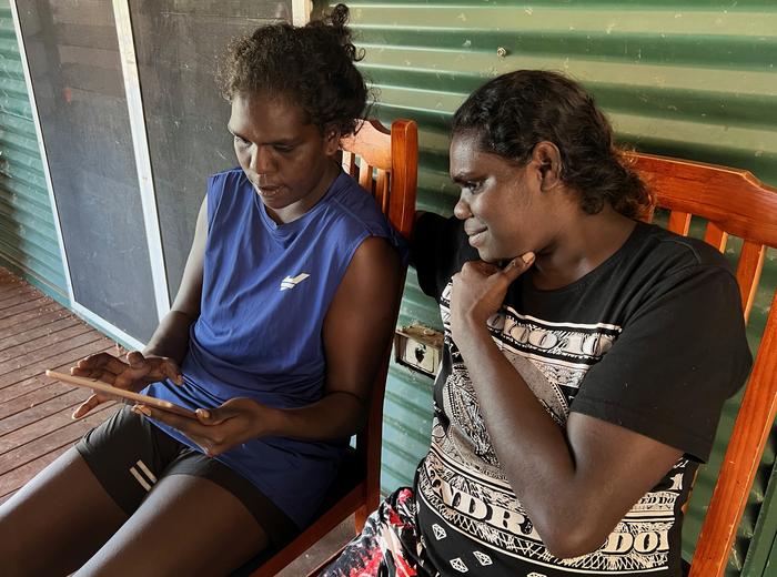 Gangan co-researcher Guruwuy Ganambarr doing survey with resident Alissia Wirrpanda