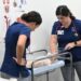 UNF nursing students practice on manikin