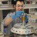 Postdoc Qiucheng Xu, preparing the reactor.