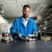 Lead author and battery researcher Gabriel Nambafu assembles a test flow battery apparatus