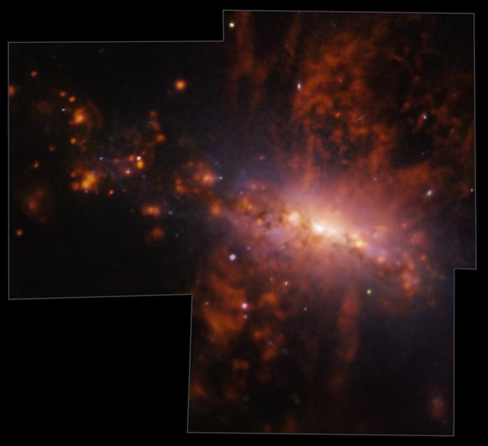 Giant galactic explosion exposes galaxy pollution in action