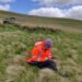 Researcher Cicely Marshall surveying farm land