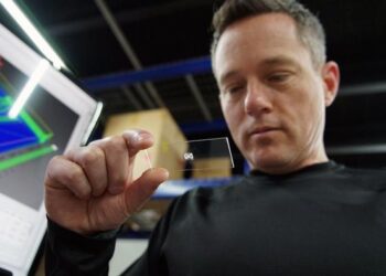 Jeff Schultz '03 inspects a 3D-printed organ on a chip at his lab in Charlotte.