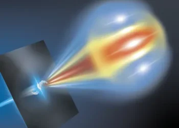 A structured beam of electron beamlets passes through a metallic foil from left to right creating coherent optical transition radiation.