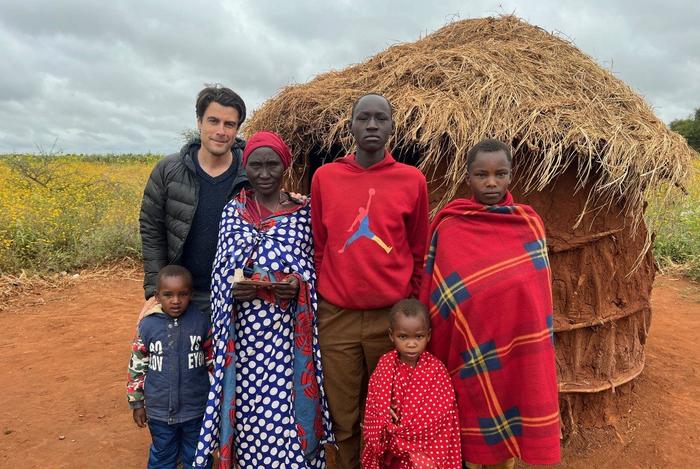 Associate Professor Timothy Baird (back row, far left) has been conducting research on how technology is changing the lives for Maasai women and communities in northern Tanzania since 2005.