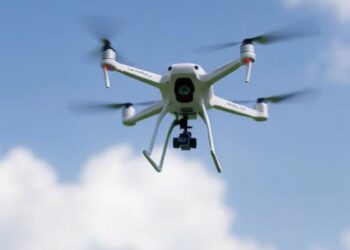 Distributed Model Predictive Control for Nano UAV Swarms