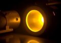 Record Brightness 590nm Yellow SHG in Quantum Well VECSEL