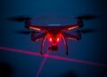 Charging drones mid-flight with lasers