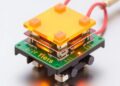 Electromechanical docking systems enable thin-film robotic and electronic module transfers