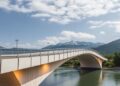 Passive radiative cooling paints bridge materials design and real-world performance
