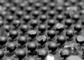 Functionalized graphene slows asphalt aging via matrix-specific anti-aging mechanisms