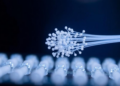 Doped Ceramic Particles Push Flexible Polymer Fibers to Record Piezoelectric Output