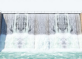 Bubbles Reshape the Hydraulic Jump: CFD Reveals a Threshold Where Air Transforms Dam Spillway Flows