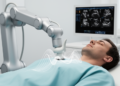 Adversarial domain adaptation for false-positive reduction in hospital-to-robotic echocardiographic screening under limited target-domain data