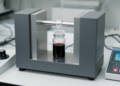 Review: Determining effective magnetic anisotropy in magnetic nanoparticles systems using DC-magnetometry methods