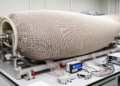 Research report: Large-area textile-based piezoresistive sensor array for hull stress distribution mapping