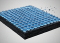 Ordered Water Networks Shield Carbon Electrodes from Corrosion