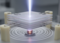 Layered magnetic crystal converts microwaves into optical signals