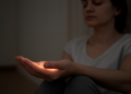 Human palm glows faintly, and meditation seems to quiet that light