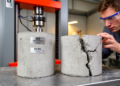 Two Concrete Design Standards, One Grade: ACI Beats BS EN on Strength but Costs More Carbon