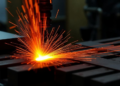 Two Recrystallization Pathways Team Up to Reshape Heat-Resistant Steel During Hot Working