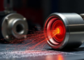 Rolling Between Critical Temperatures Keeps Nano-Oxides Fine in Nuclear Steel