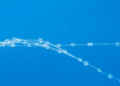 Flawed Fibers, Cleaner Water: Bead-on-String Defects Turned Into Antibiotic Traps