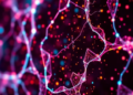 Near-infrared holography breaks the visible-light scattering barrier in lensless microscopy