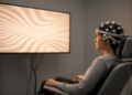Beyond flickering: code-modulated motion visual evoked potentials bring flicker-free control to brain-computer interfaces