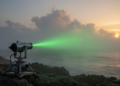 Tricomi beams reveal how humidity reshapes light scattering over the sea